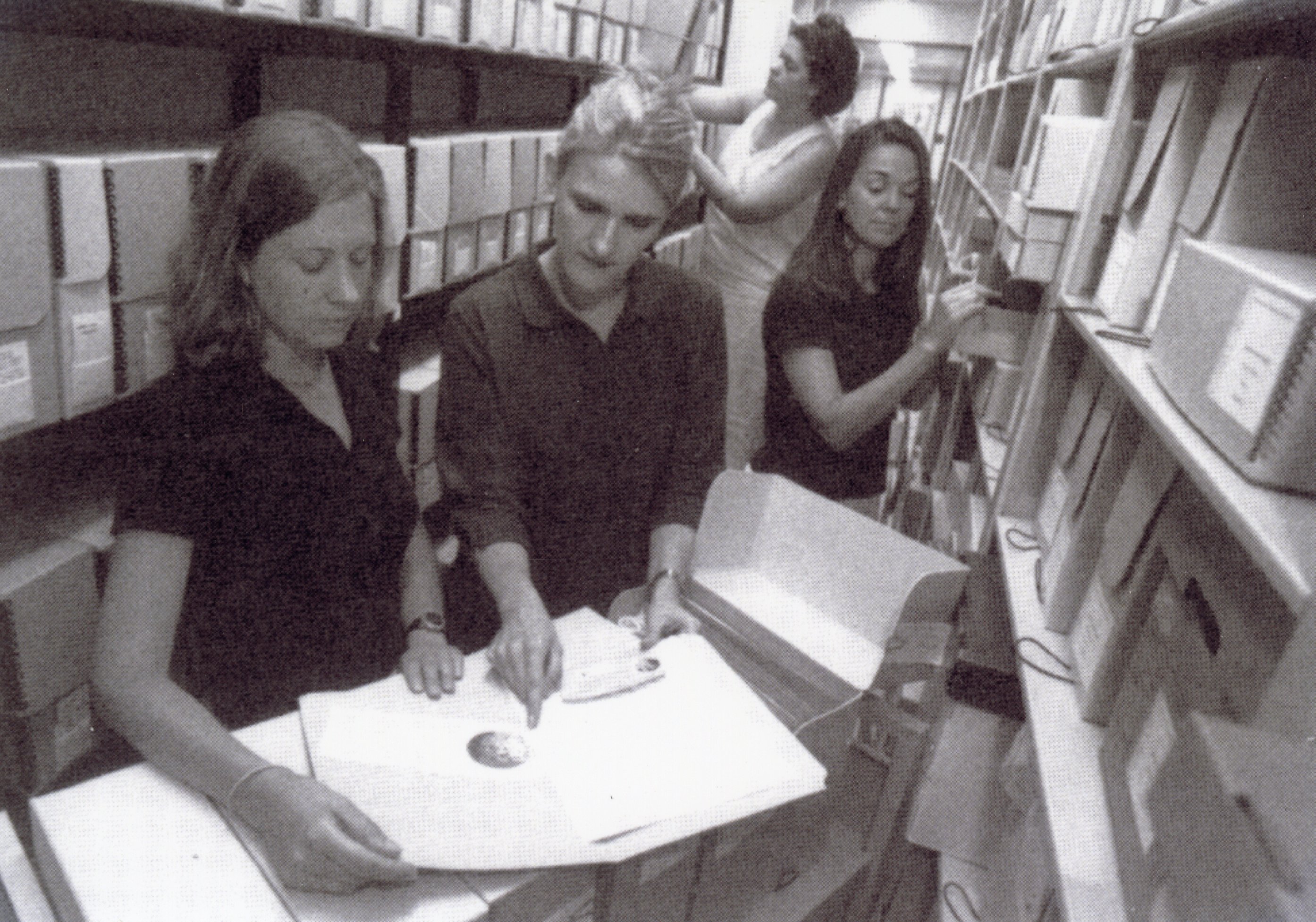 Laura Carroll, WLA graduate assistant (left), assists the first group of summer WLA research grant recipients: Angela Schlater, Chiara Sabina, and Michelle Clifton-Soderstrom.2001